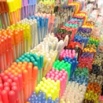 Rows of colorful gel pens on a shop shelf, the kind of bulk pen pack nurses ask for as a gift