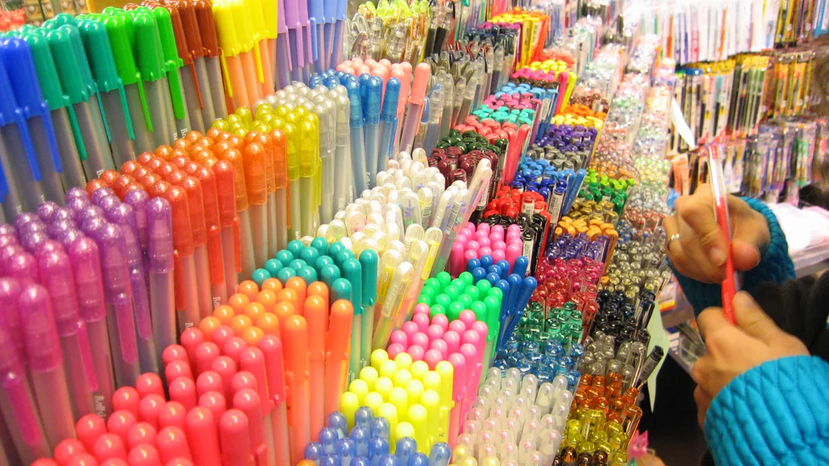 Rows of colorful gel pens on a shop shelf, the kind of bulk pen pack nurses ask for as a gift